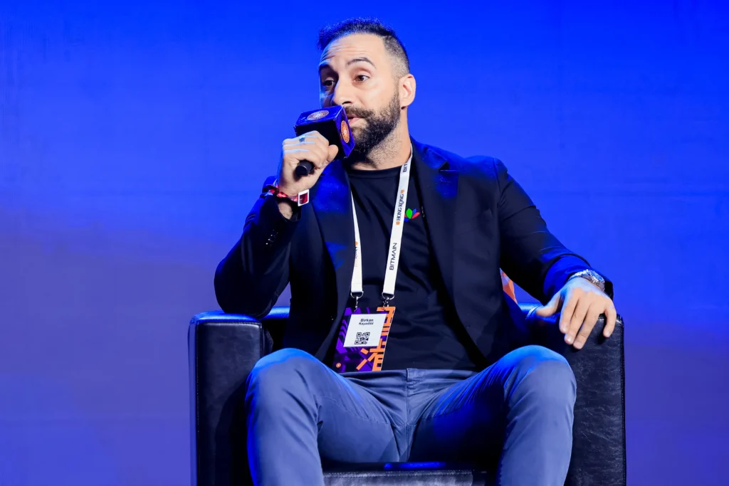 Birkan Kayadibi speaking on stage at Bitcoin Asia